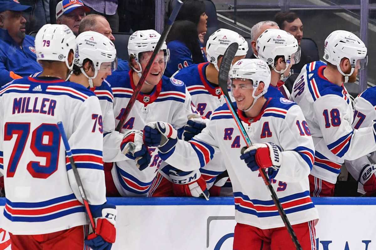 Rangers center Ryan Strome celebrates a goal with the New York Rangers bench.
