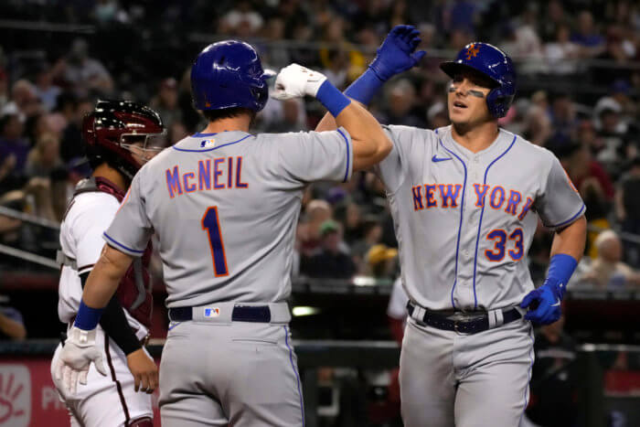 Mets catcher James McCann celebrates with second baseman Jeff McNeil after hitting a two-run home run against the Arizona Diamondbacks.