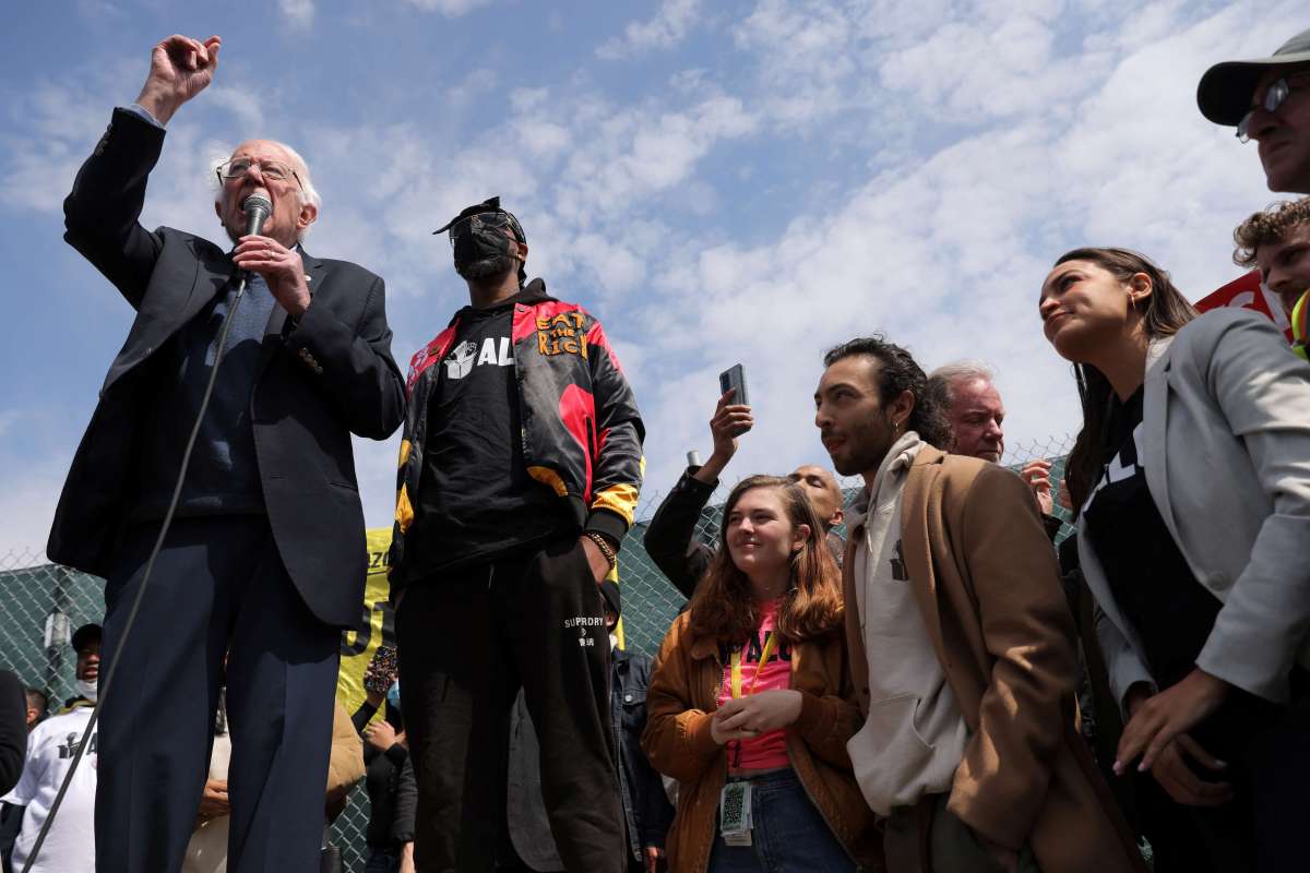 Senator Bernie Sanders speaks next to Amazon Labour Union (ALU) organizer Christian Smalls and Rep. Alexandria Ocasio-Cortez at an Amazon facility during a rally in Staten Island.