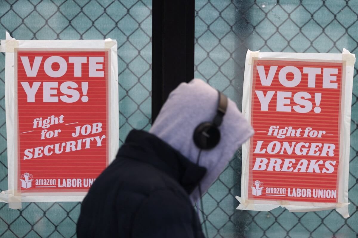 Amazon Labour Union (ALU) signage is seen on a bus shelter near an Amazon facility in Staten Island, New York City