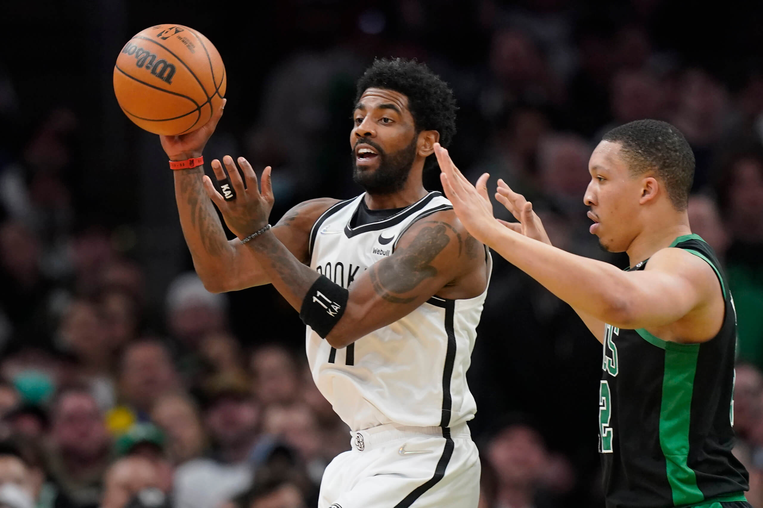 Brooklyn Nets offseason off to a dramatic start with Kyrie Irving stance 2 Brooklyn Nets guard Kyrie Irving passes the ball under pressure from Boston Celtics forward Grant Williams.