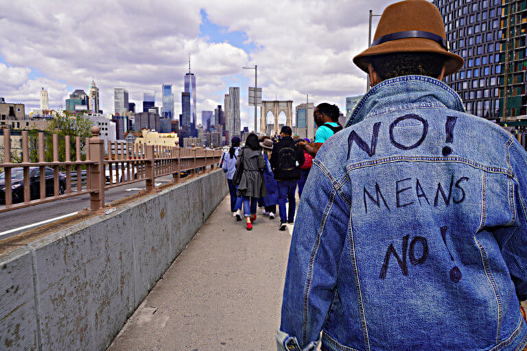Denim Day: Hundreds march over Brooklyn Bridge to raise awareness of ...