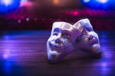 Theater masks on a dark background/ 3D rendering