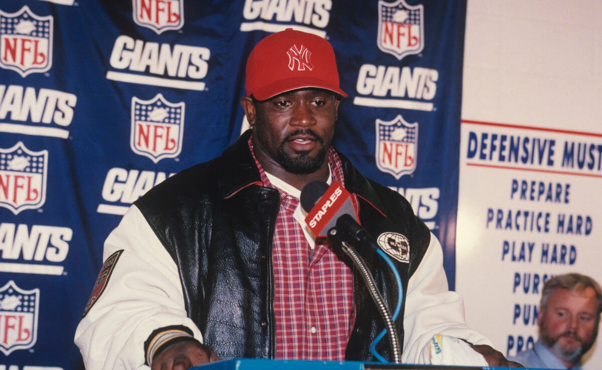 Gary Brown of the New York Giants speaks during a press conference after a game from the Giants 1998 season.