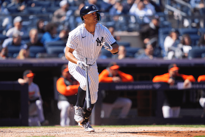 Yankees designated hitter Giancarlo Stanton runs out an RBI single against the Baltimore Oriole.