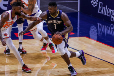 Pelicans forward Zion Williamson dribbles against New York Knicks forward Reggie Bullock in 2021.