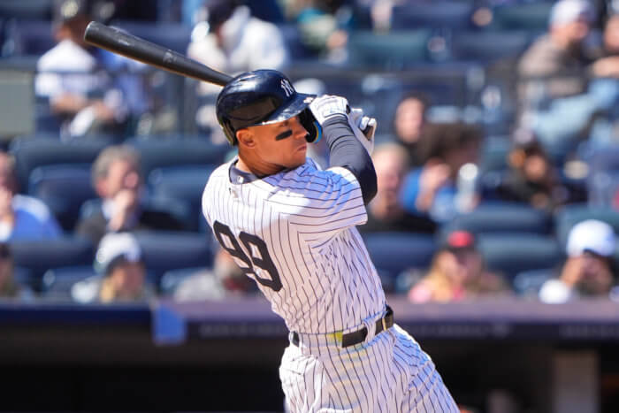 Yankees right fielder Aaron Judge hits an RBI single.