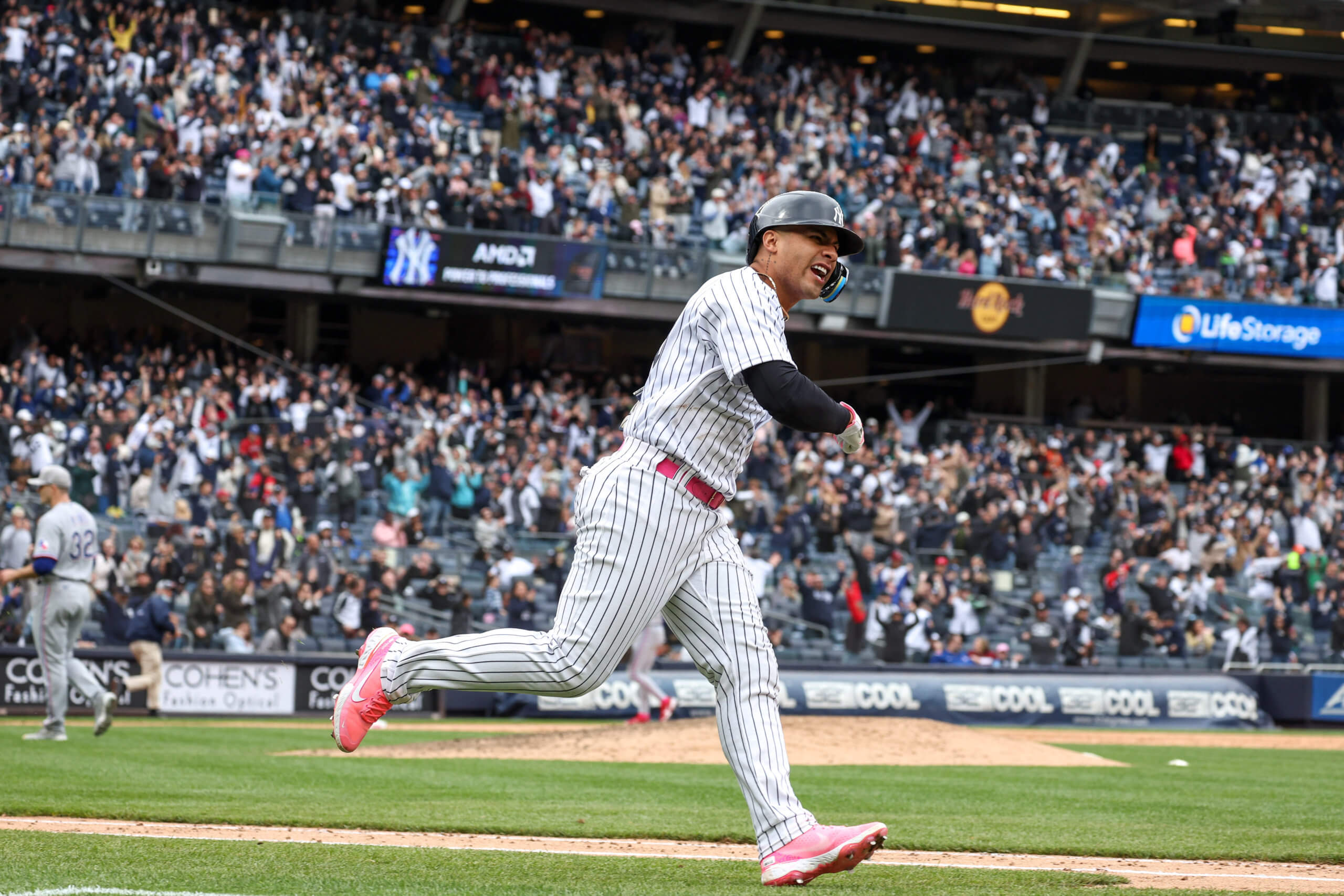 DENVER, CO - JULY 15: New York Yankees second baseman Gleyber Torres (25)  runs after hitting a first inning triple during a game between the New York  Yankees and the Colorado Rockies