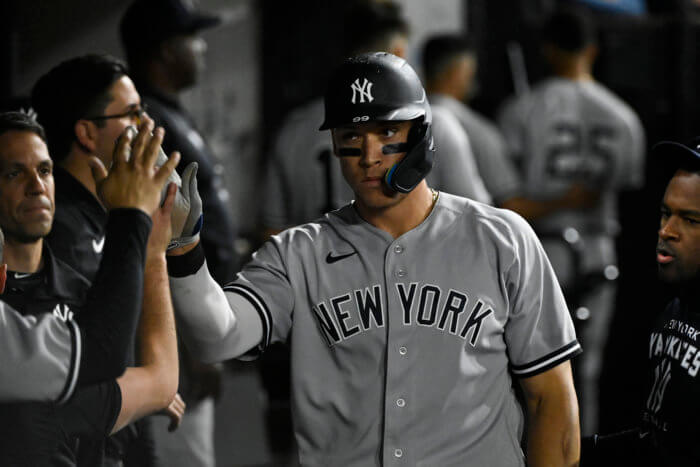 Aaron Judge celebrates after scoring against the White Sox.