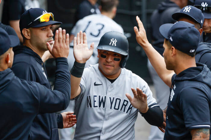 Yankees catcher Jose Trevino celebrates with teammates after scoring against the White Sox during the 2nd inning.