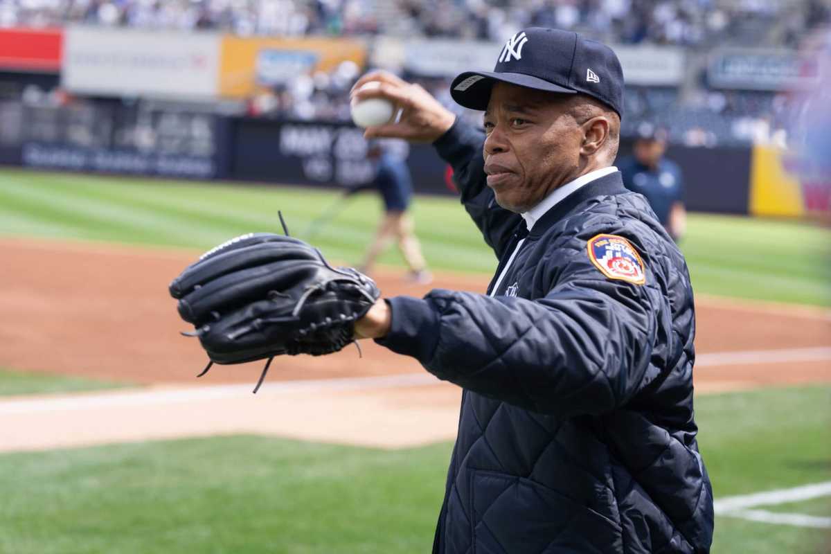 Mayor Eric Adams warms up to throw at Opening Day for the New York Yankees last month.