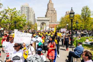 Hundreds marched from Washington Square Park for a May Day rally.