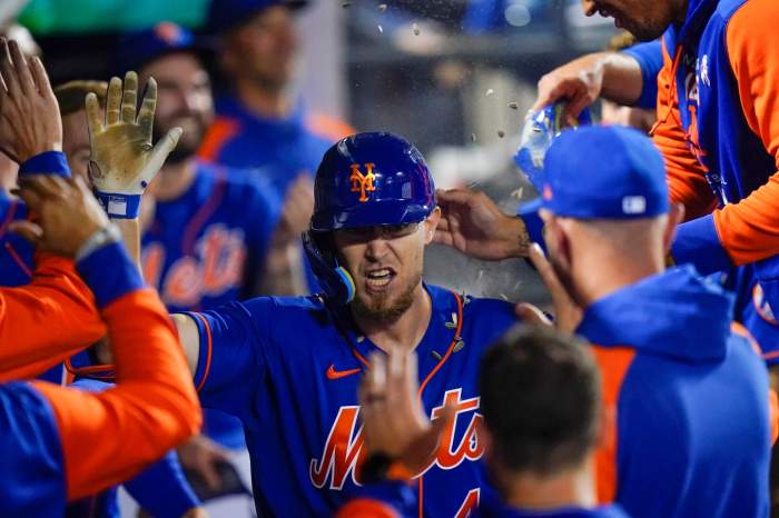 Mets' Patrick Mazeika celebrates with teammates after hitting a home run during the 7th inning of a baseball game against the Mariners Saturday.