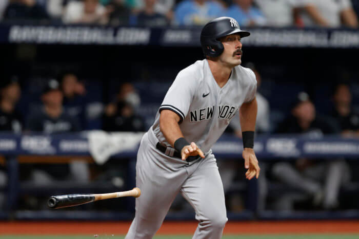 Yankees' Matt Carpenter watches his home run against the Tampa Bay Rays during the 4th inning.