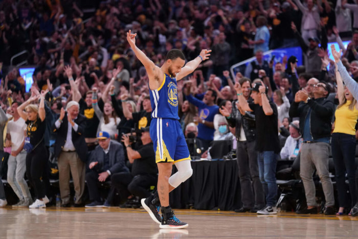 Stephen Curry celebrates a 2022 NBA Playoffs win
