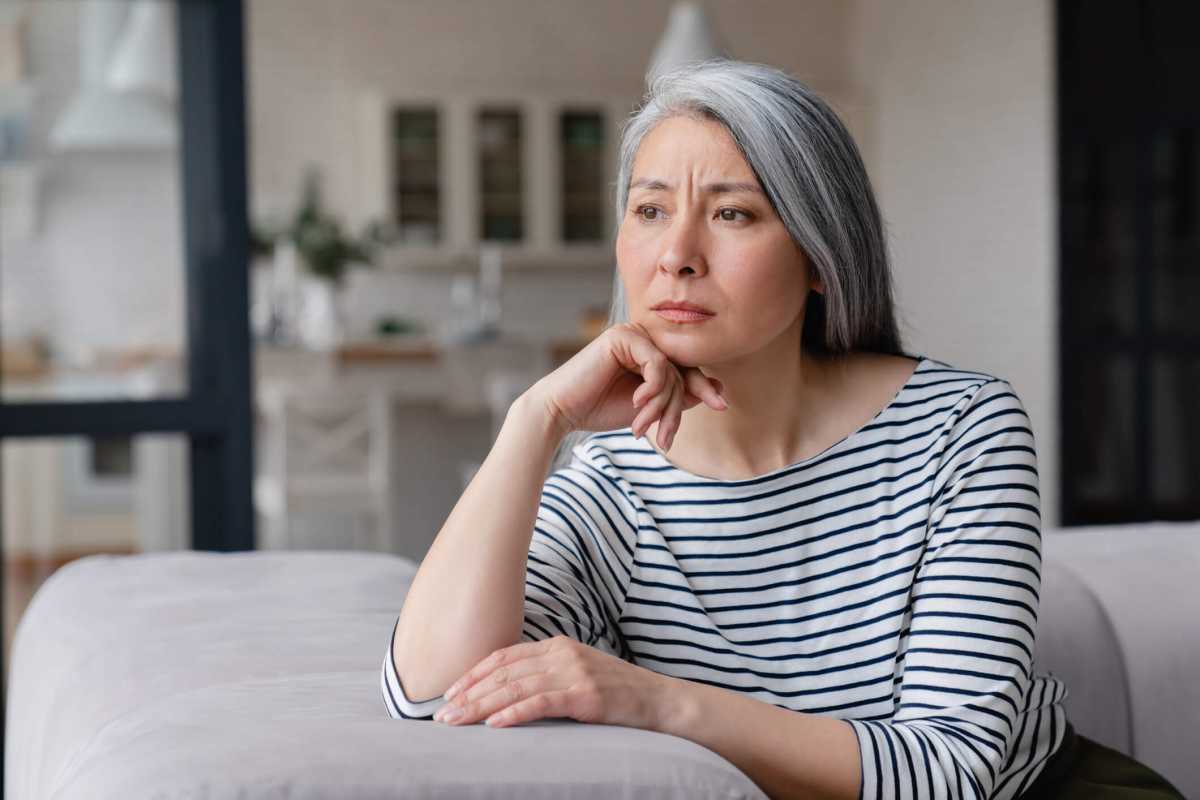 Sad depressed tired lonely divorced ill mother mature woman feeling unwell, unhealthy, suffering from midlife crisis on lockdown, social distance