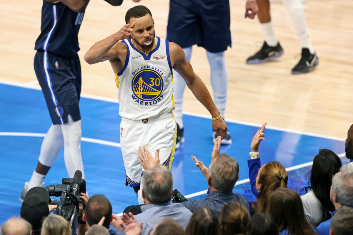Golden State Warriors' Steph Curry celebrates a basket.