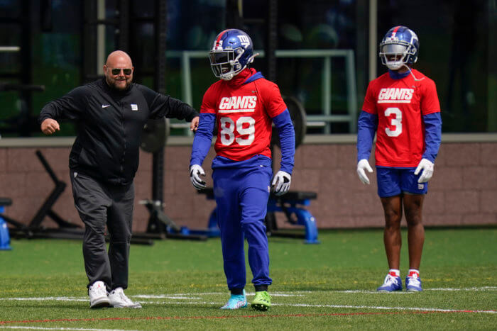 New York Giants head coach Brian Daboll, left, jokes with Kadarius Toney, center, and Sterling Shepard.