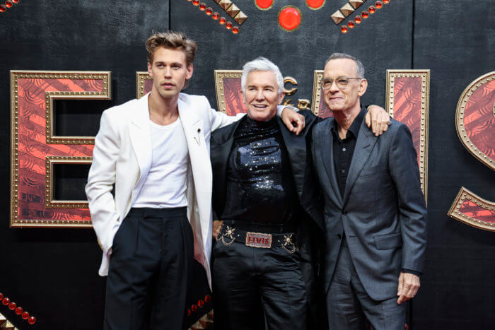 Austin Butler, from left, director Baz Luhrmann, and Tom Hanks pose for photographers upon arrival for the premiere of the film 'Elvis' in London Tuesday, May 31, 2022. 