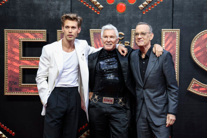 'Elvis,' 'Top Gun' tie for box-office crown with $30.5M each 2 Austin Butler, from left, director Baz Luhrmann, and Tom Hanks pose for photographers upon arrival for the premiere of the film 'Elvis' in London Tuesday, May 31, 2022.
