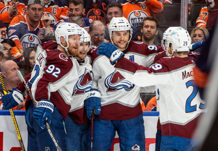 NHL Colorado Avalanche's Gabriel Landeskog (92), Artturi Lehkonen (62), Kurtis MacDermid (56) and Nathan MacKinnon (29) celebrate a goal.