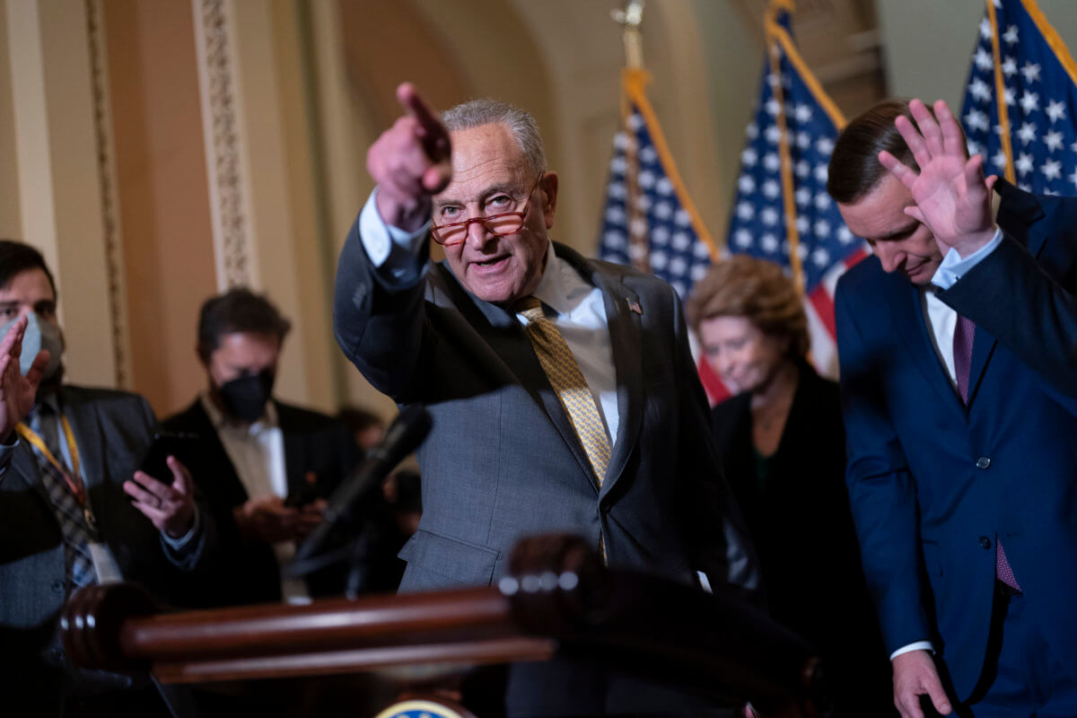 Senate Majority Leader Chuck Schumer of New York is joined at right by Sen. Chris Murphy of Connecticut to discuss the gun bill