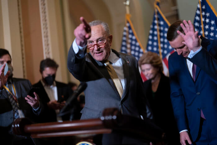 Senate Majority Leader Chuck Schumer of New York is joined at right by Sen. Chris Murphy of Connecticut to discuss the gun bill