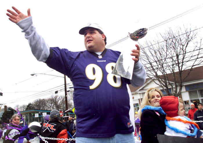 The Goose Tony Siragusa, defensive tackle for the Super Bowl-champion Baltimore Ravens, holds the Vince Lombardi trophy.