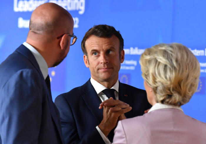 European Commission President Ursula von der Leyen, right, speaks with French President Emmanuel Macron, center, and European Council President Charles Michel prior to a group photo with Western Balkan leaders at an EU summit in Brussels.