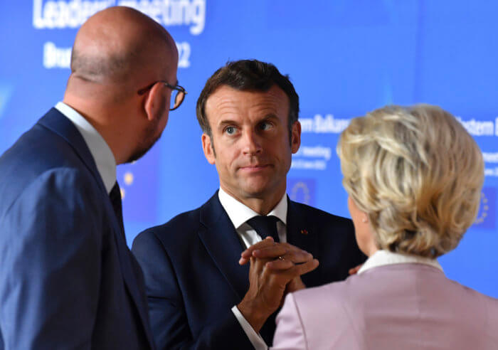 European Union leaders set to grant Ukraine candidate status after invasion 2 European Commission President Ursula von der Leyen, right, speaks with French President Emmanuel Macron, center, and European Council President Charles Michel prior to a group photo with Western Balkan leaders at an EU summit in Brussels.