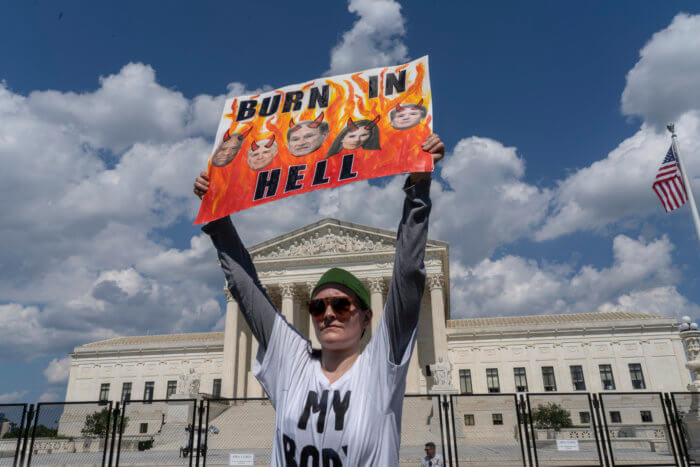 Supreme Court's abortion ruling sets off new court fights 2 An abortion-rights protester displays a placard during a demonstration outside the Supreme Court in Washington, Saturday, June 25, 2022. The U.S. Supreme Court's decision to end constitutional protections for abortion has cleared the way for states to impose bans and restrictions on abortion — and will set off a series of legal battles.