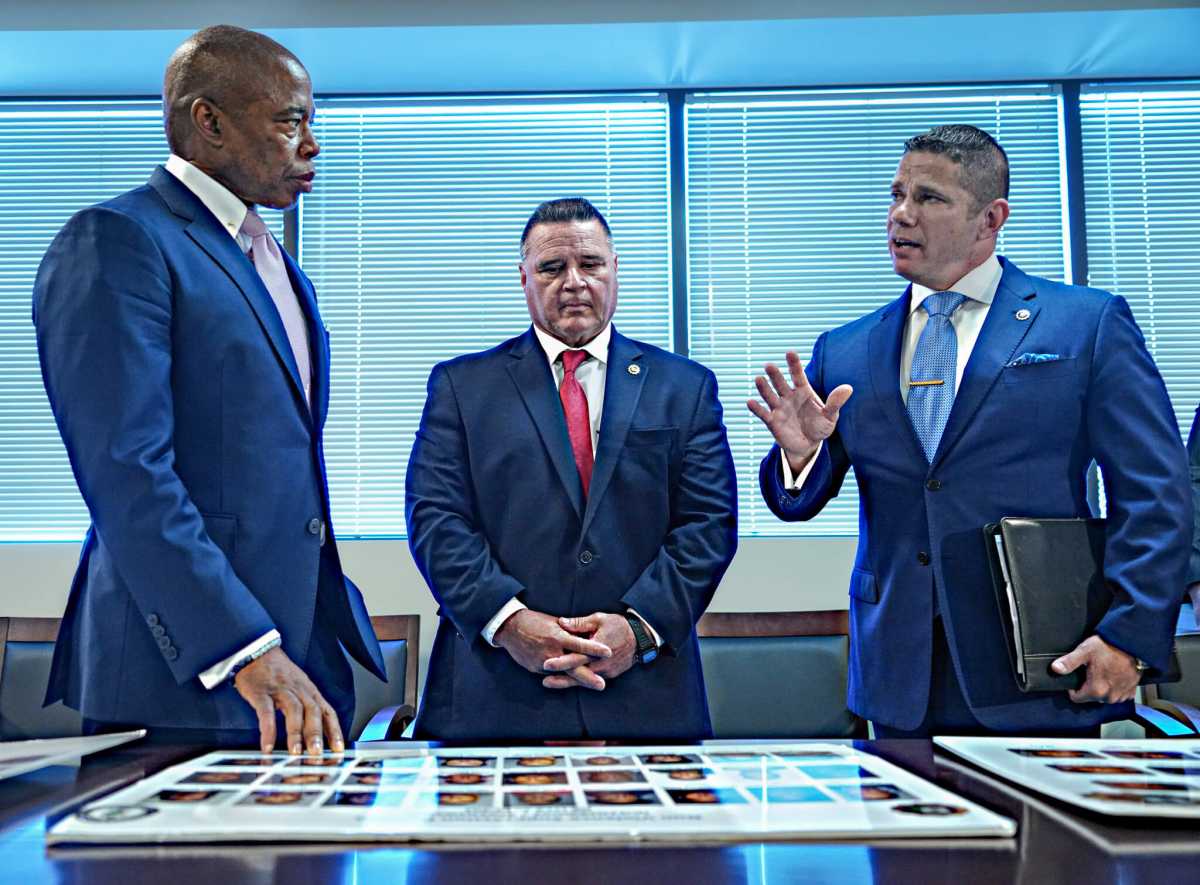 Mayor Eric Adams was shown four large boards spread across two tables on June 6, each one illustrating faces of alleged dangerous gang members.
