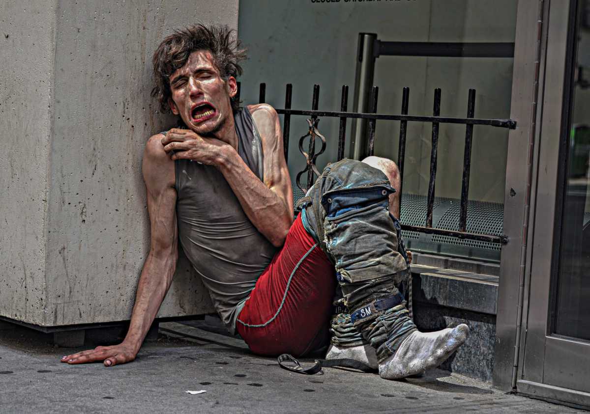 A homeless man suffers in plain sight in the Garment District.