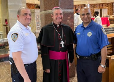 Bishop Robert Brennan with Detective Mohamed Amen.