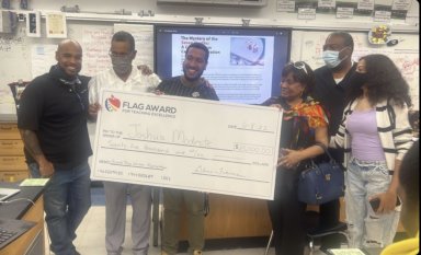 Teacher Joshua Modeste wins FLAG award for teaching excellence.