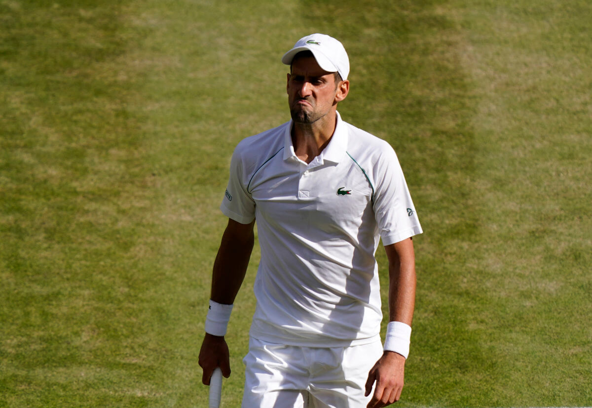Serbia's Novak Djokovic reacts to losing a point against in the Wimbledon tennis championships.