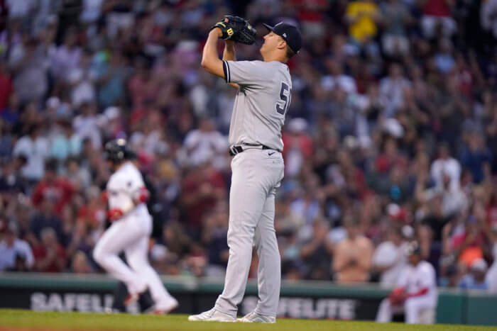 Yankees' Jameson Taillon, right, stands on the mound as Red Sox's Christian Vazquez, left, runs the bases toward home after hitting a home run off a pitch by Taillon in the third inning.