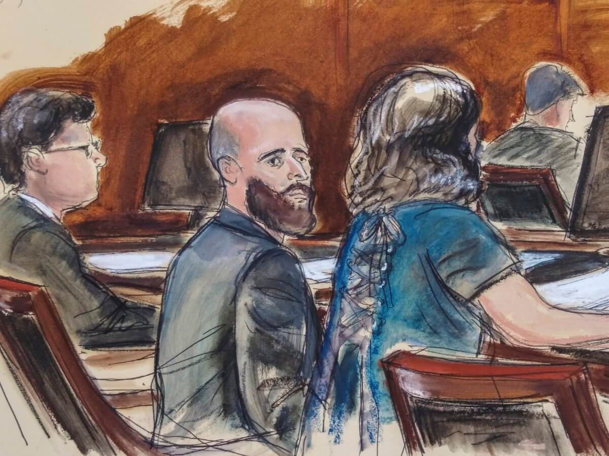 In this courtroom sketch, Joshua Schulte, center, is seated at the defense table flanked by his attorneys during jury deliberations, Wednesday March 4, 2020, in New York. Schulte, the former CIA software engineer accused of causing the biggest theft of classified information in CIA history, has been convicted at a New York City retrial. A jury reached the guilty verdict against Joshua Schulte on Wednesday, July 13, 2022 in federal court in Manhattan.