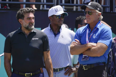 Yasir Al-Rumayyan, governor of Saudi Arabia's Public Investment Fund, left, Majed Al-Sorour, CEO of Golf Saudi, center, and Greg Norman, CEO of LIV Golf, watch at the first tee during the second round of the Bedminster Invitational LIV Golf tournament in Bedminster.