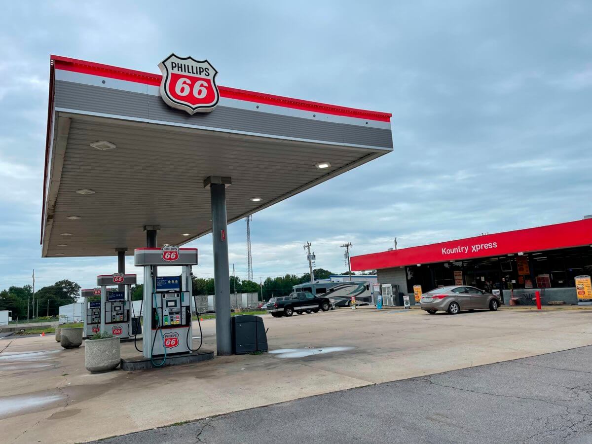 A car is parked outside the Kountry Xpress in Mulberry, Ark. Three law enforcement officers have been suspended after a video posted on social media showed a South Carolina man being held down on the ground and beaten by police. Arkansas State Police said Sunday night that it would investigate the use of force by the officers earlier in the day outside the convenience store in Mulberry, about 140 miles northwest of Little Rock.
