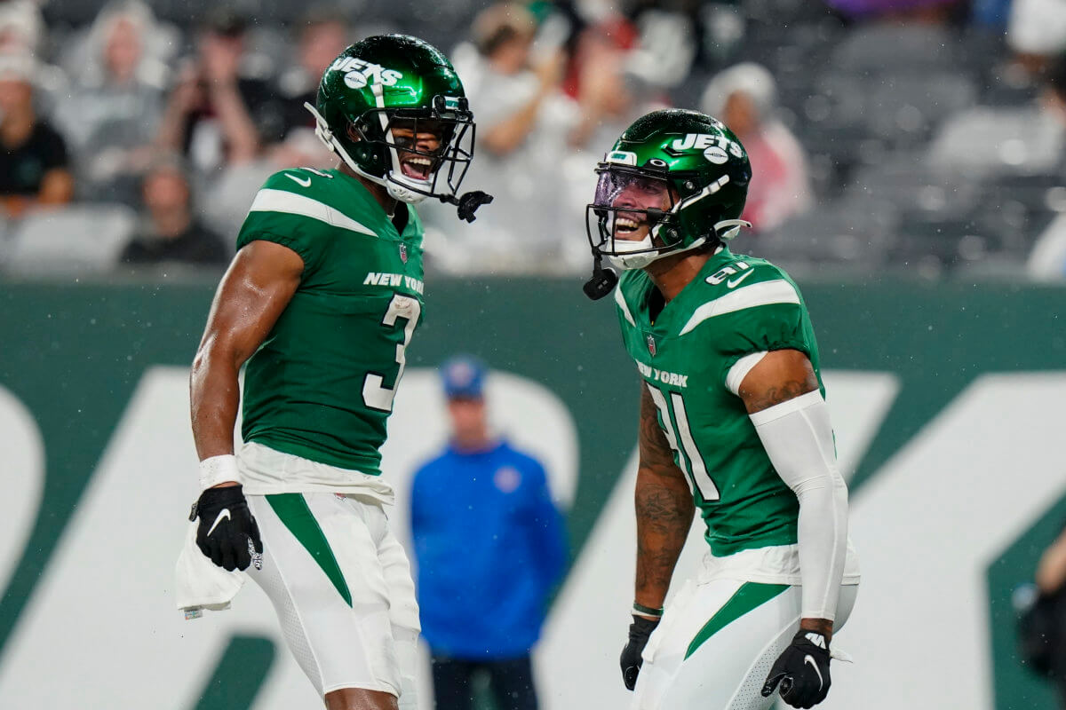 Jets tight end Lawrence Cager (81) celebrates his touchdown with wide receiver Tarik Black (3) during the 2nd half of an NFL football game against the Atlanta Falcons on Aug. 22.
