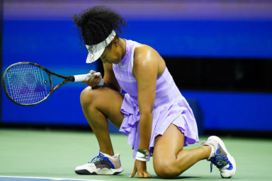 Naomi Osaka reacts after missing a shot during a match against Danielle Collins.
