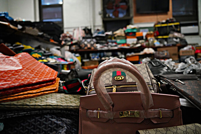 New York, NY - November 9, 2020: Street vendors sell counterfeits goods  like bags, sunglasses, belts and watches on Canal street and Broadway  corners Stock Photo - Alamy