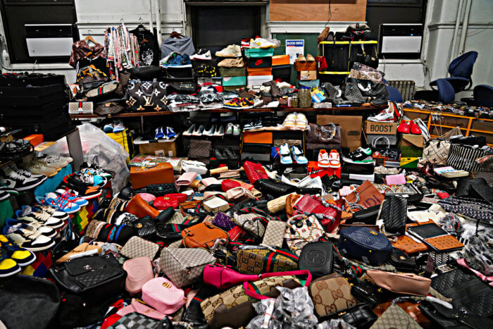 NYPD pulls off massive counterfeit goods bust on Canal Street - CBS New York