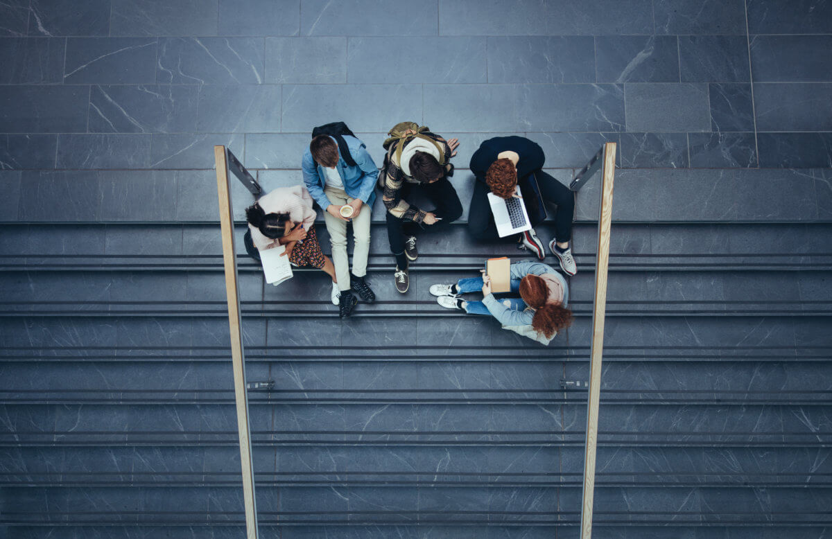 Students sitting in college campus