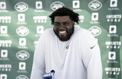 Jets tackle Mekhi Becton speaks to the media at the NFL football team's practice facility.