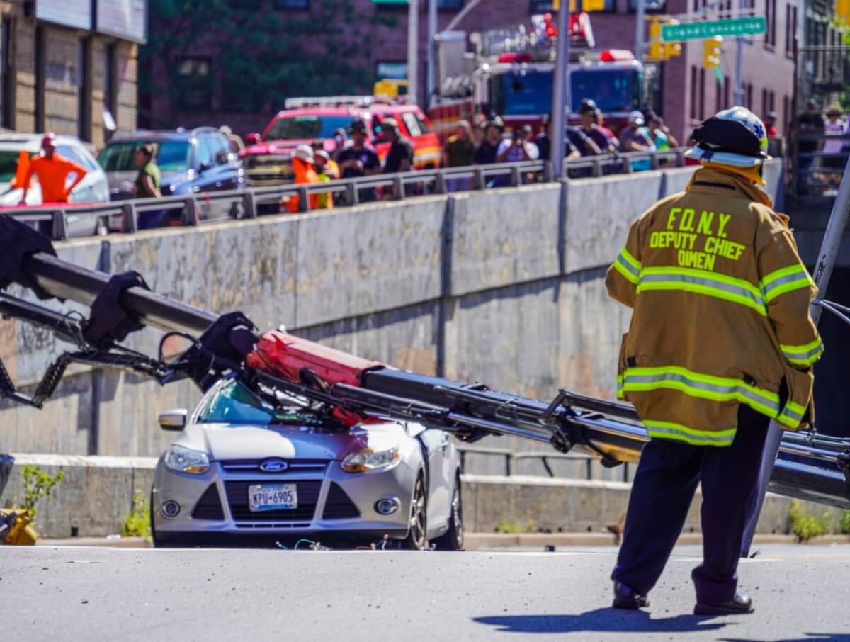 Bronx crane collapse crushes car, injures motorist FDNY amNewYork