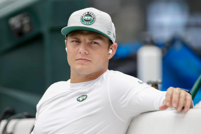Jets quarterback Zach Wilson sits on the bench during practice before a preseason game against the New York Giants.