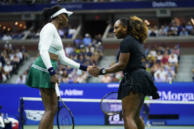 Serena Williams, right, and Venus Williams, celebrate during their first-round doubles match against Lucie Hradecká and Linda Nosková, of the Czech Republic.