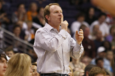 Phoenix Suns owner Robert Sarver gestures to Indiana Pacers' Danny Granger after Granger missed a shot during the second half of an NBA basketball game.